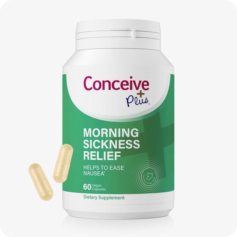 Conceive Plus Morning Sickness Relief supplement bottle featuring a green and white label with 60 vegan capsules and highlights its purpose to help ease nausea during pregnancy. Two light yellow capsules are displayed beside the bottle.