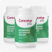 Triple pack of Conceive Plus Morning Sickness Relief bottles, each labeled in green and white. Product is formulated to help ease nausea during pregnancy and contains 60 vegan capsules per bottle. Dietary supplement crafted for prenatal support.