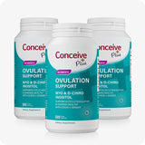 The image of three packs or bottles of Conceive Plus Ovulation Support US on a white background. The packs or bottles are placed in a triangle with one bottle in front and two bottles behind and the front bottle is covering half of each bottles of behind. The bottles are placed facing front
